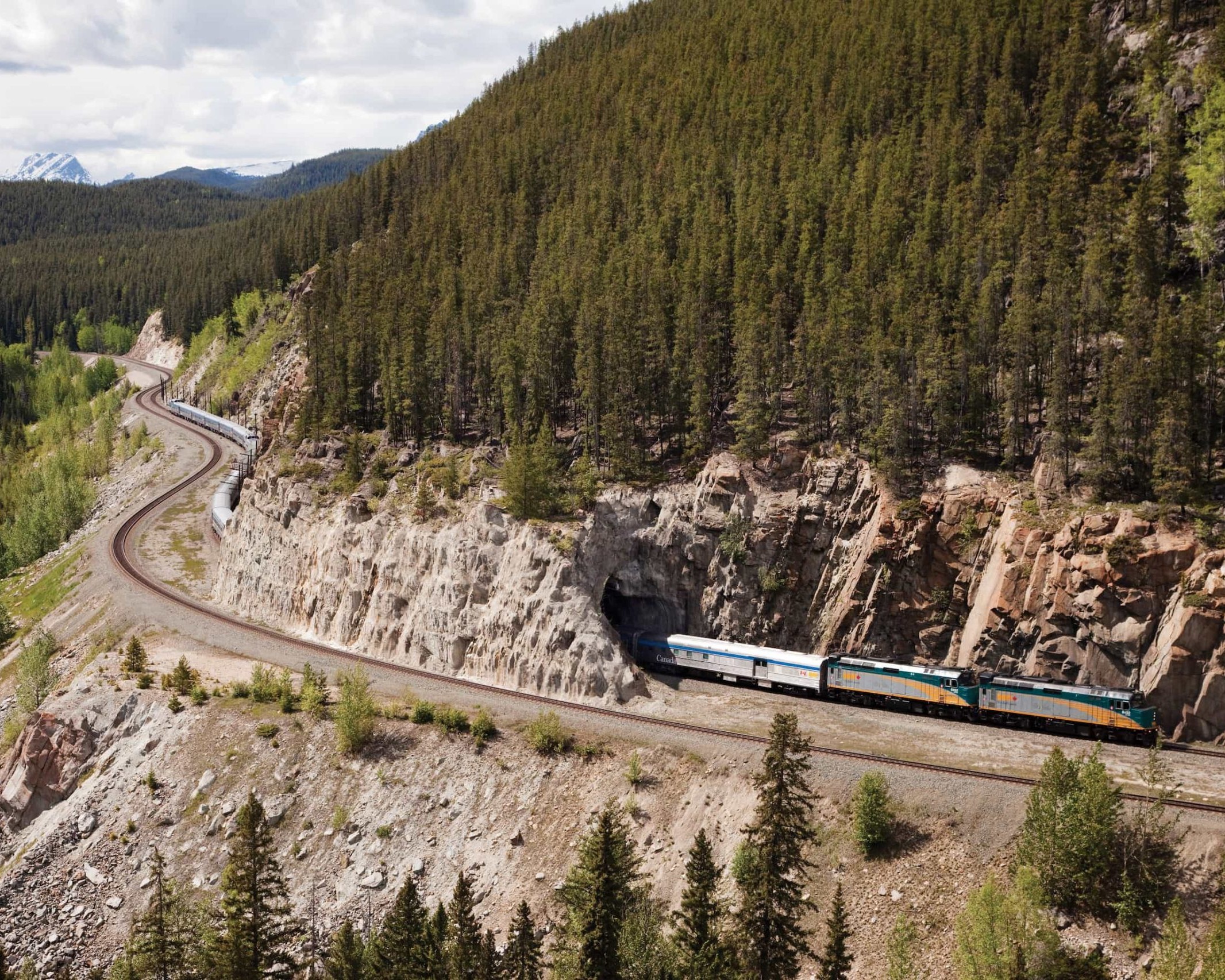 A luxury train travelling through mountains